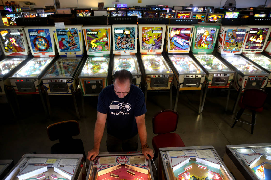 Norm Dunn of Costa Rica plays a pinball machine at the Pinball Hall of Fame at 1610 E. Tropican ...