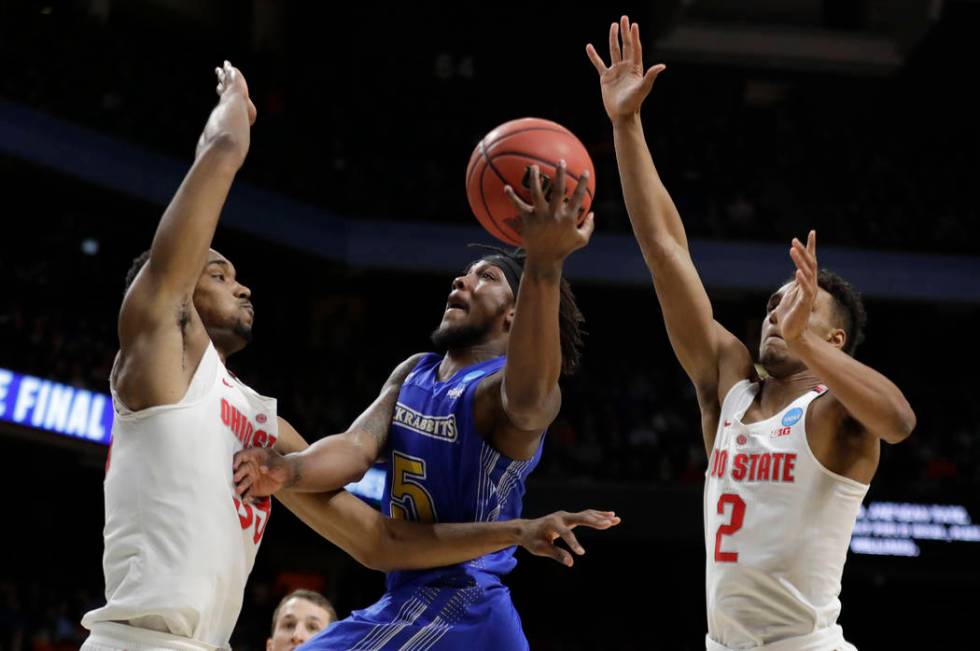 South Dakota State guard David Jenkins Jr. (5) puts up a shot as Ohio State forward Keita Bates ...