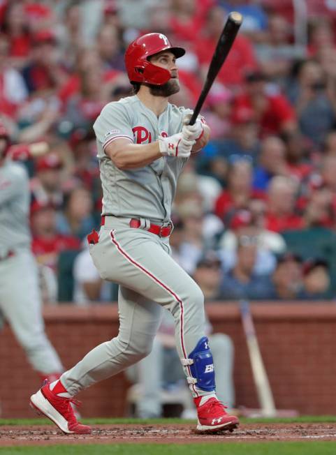Philadelphia Phillies' Bryce Harper watches his grand slam during the second inning of the team ...