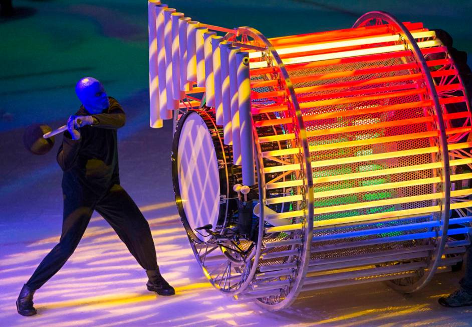 A member of Cirque du Soleil's Blue Man Group performs on the second intermission during an NHL ...