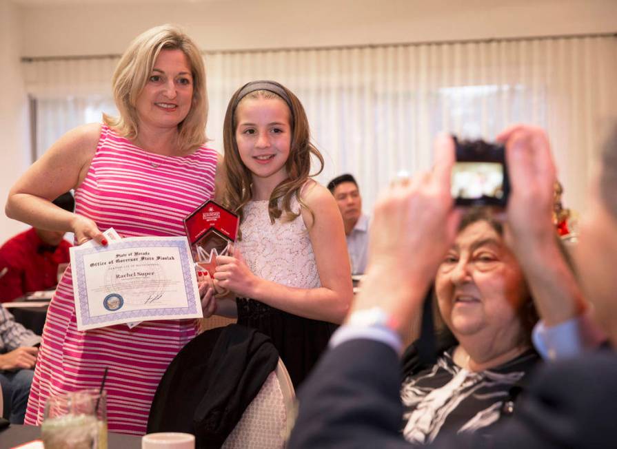 Award winner Rachel Super, second from left, a fifth grader at Adelson Educational Campus, pose ...