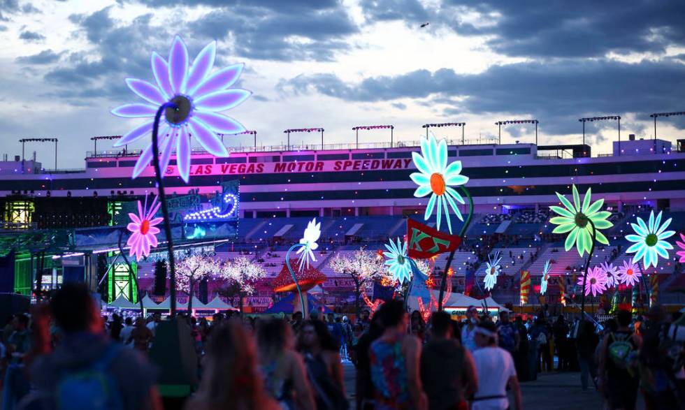 Attendees crowd the festival grounds as the third day of the Electric Daisy Carnival kicks off ...