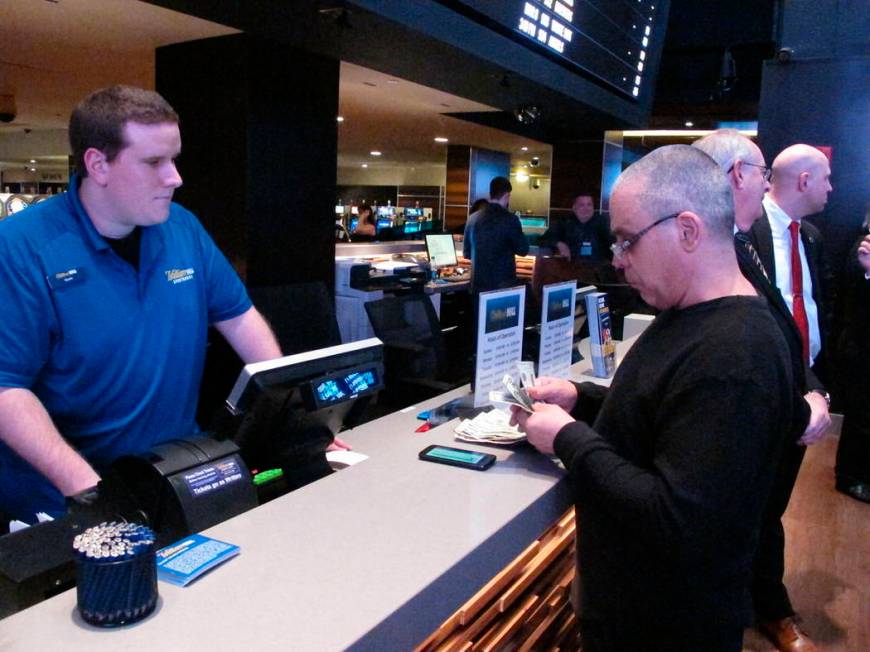 This March 8, 2019 photo shows a gambler making a sports bet at the Tropicana casino in Atlanti ...