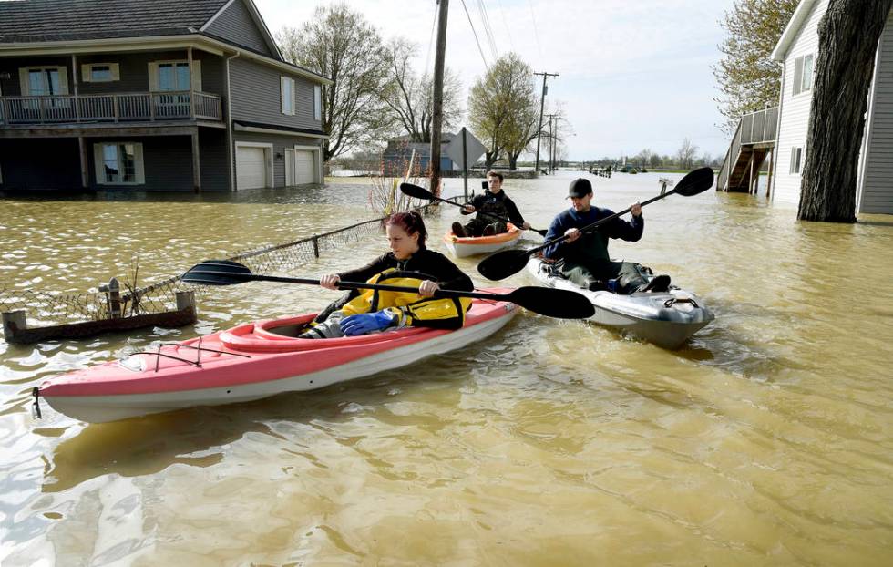 In this Wednesday, May 8, 2019 photo, Estral Beach Firefighters Courtney Millar, Eric Bruley, a ...