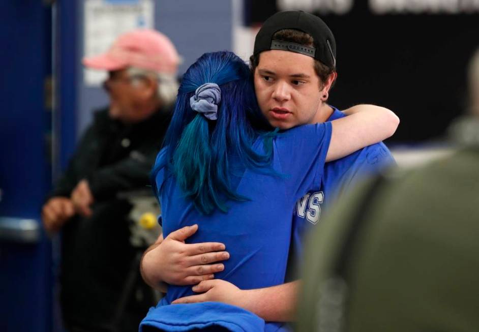 Audrey Glenn, left, hugs Andrew Schoenherr, a student at the STEM School Highlands Ranch, durin ...