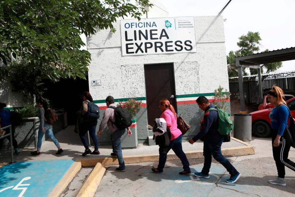 Cuban migrants are escorted by Mexican immigration officials in Ciudad Juarez, Mexico, on April ...