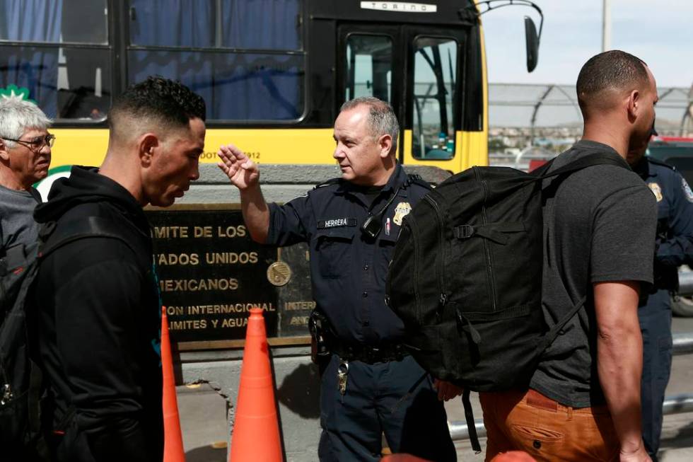 Cuban migrant are escorted by Mexican immigration officials in Ciudad Juarez, Mexico, on April ...