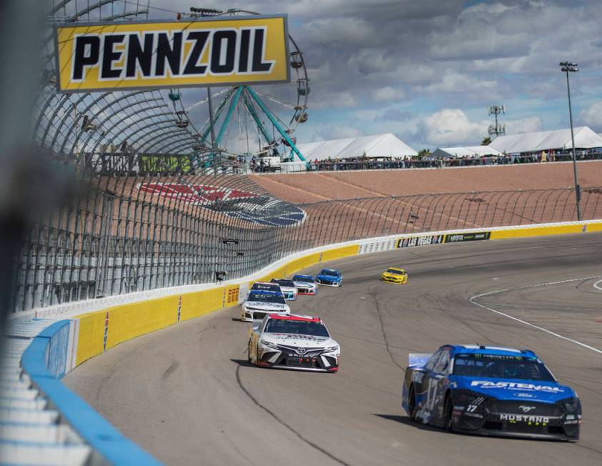 Ricky Stenhouse Jr. (17) leads a pack of racers during the Monster Energy NASCAR Cup Series Pen ...