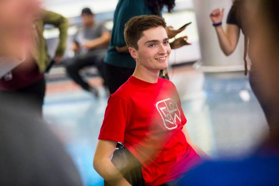 Faith Lutheran senior Mark Wilbourne reacts to a welcome party at McCarran International Airpor ...