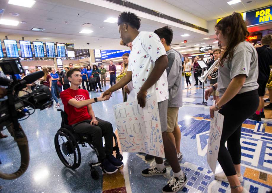 Faith Lutheran senior Mark Wilbourne, left, greets David Heckard during a welcome party at McCa ...