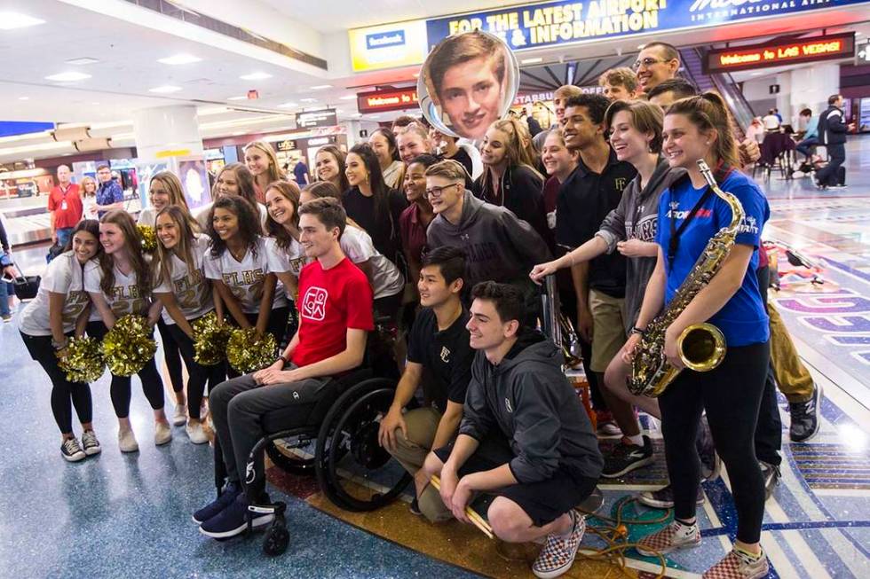 Faith Lutheran senior Mark Wilbourne, in red, poses for a photo during a welcome party at McCar ...