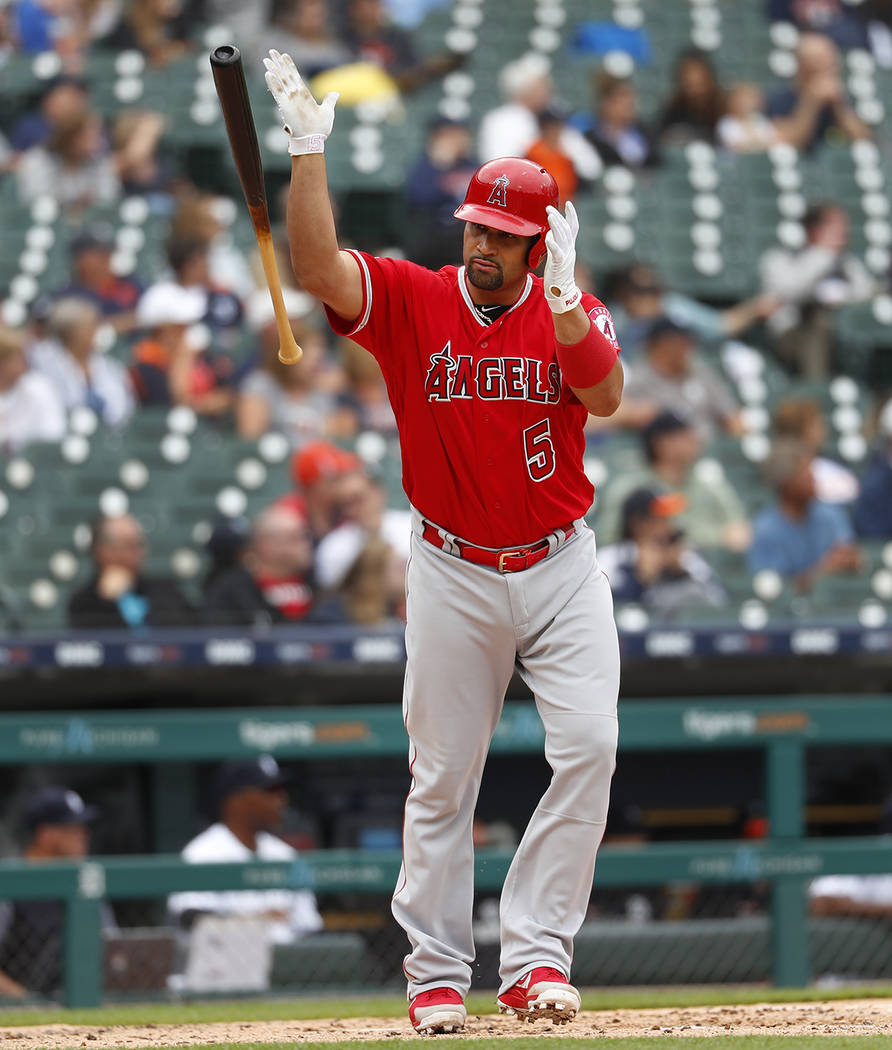 Los Angeles Angels' Albert Pujols tosses his bat after hitting a solo home run in the third inn ...