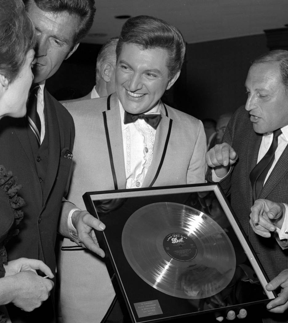 Liberace celebrates with his mother Frances at the Riviera for his 1965 Dot Silver Record on Se ...