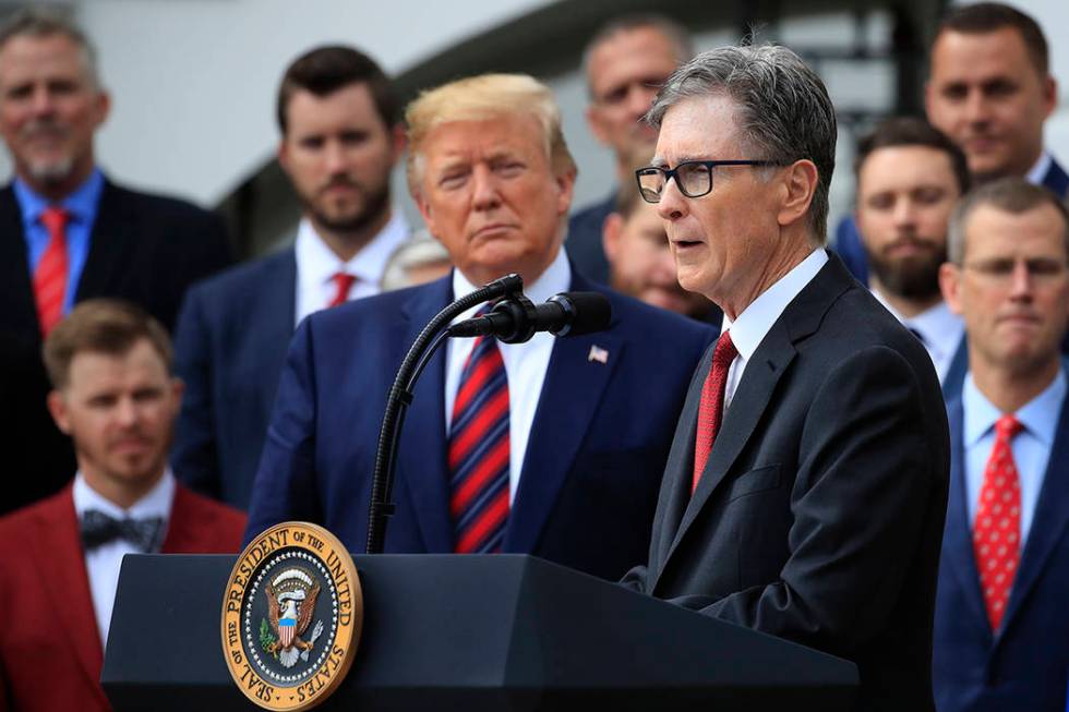 President Donald Trump listens as Red Sox owner John Henry speaks during a ceremony welcoming t ...
