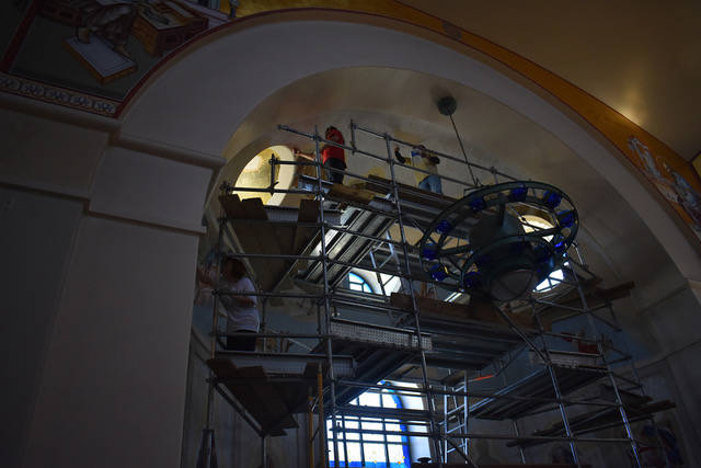 The iconographers from Greece working on the icons in St. John the Baptist Greek Orthodox Churc ...