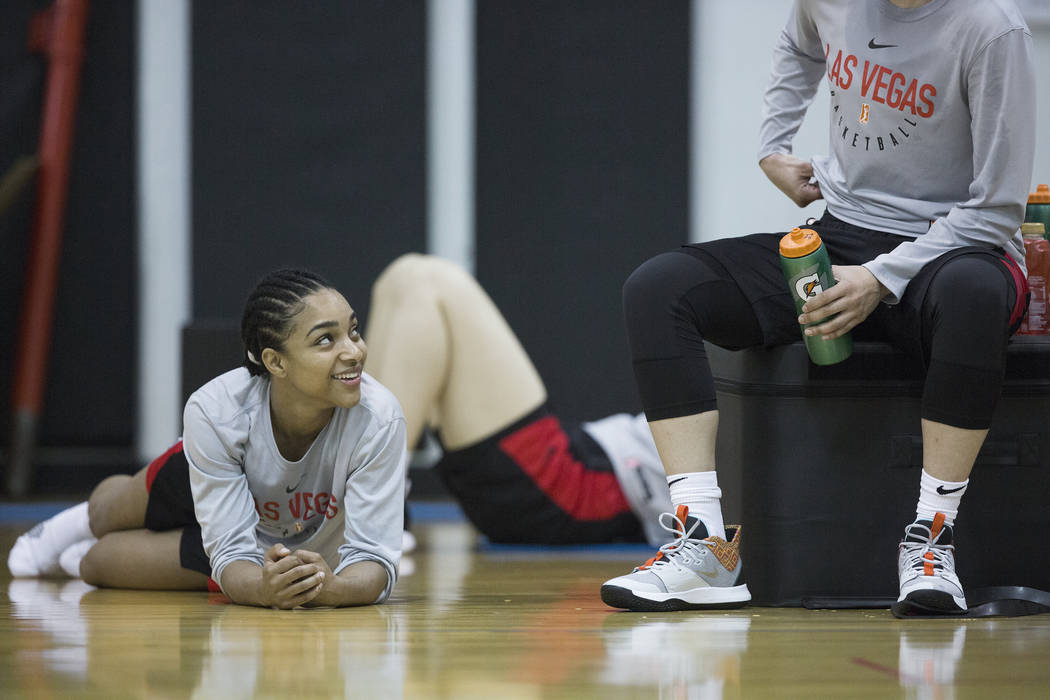 Dominique Wilson, left, talks with Aces players after practice on Friday, May 10, 2019, at Cox ...