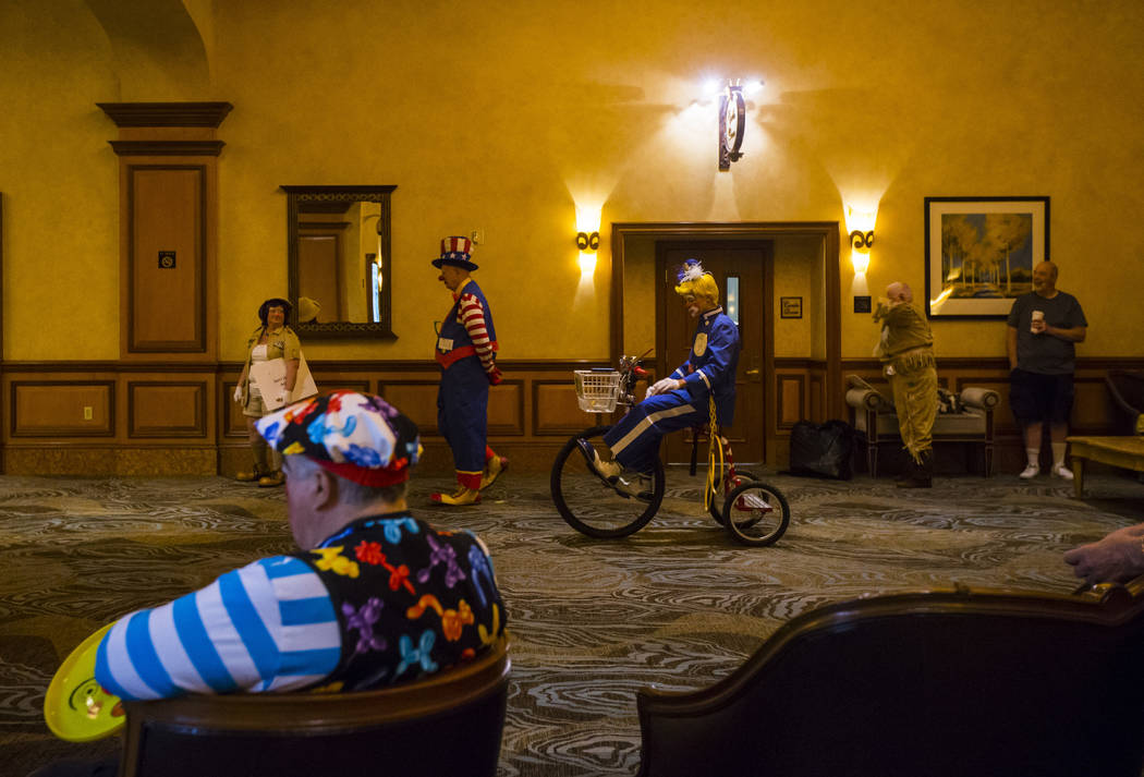 Jesse Recker, also known as Sodacracker the Clown, center, of Mesa, Ariz., waits to compete in ...