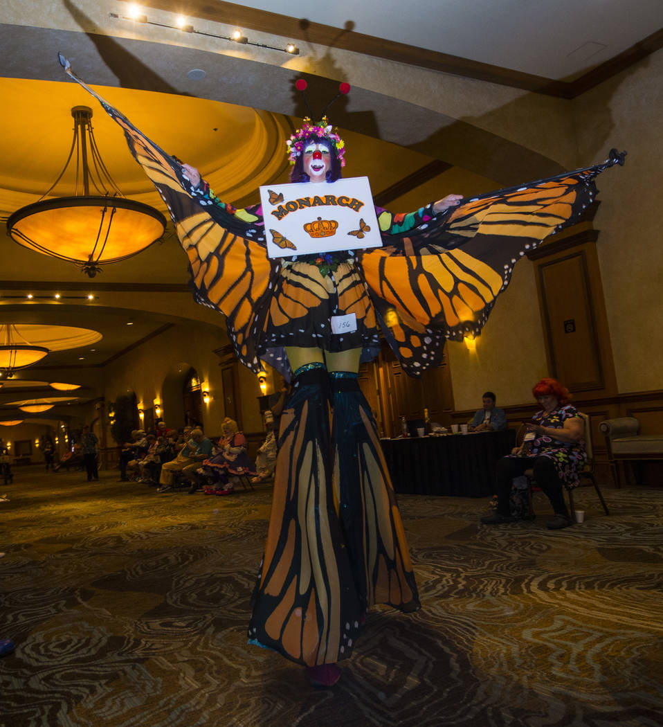 Julie Varholdt, who goes by Lovely Buttons, of Tempe, Ariz., walks on stilts during the paradea ...