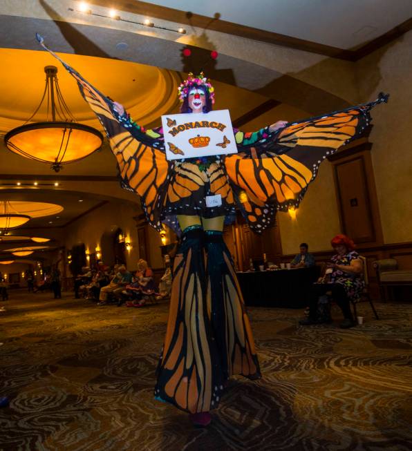 Julie Varholdt, who goes by Lovely Buttons, of Tempe, Ariz., walks on stilts during the paradea ...