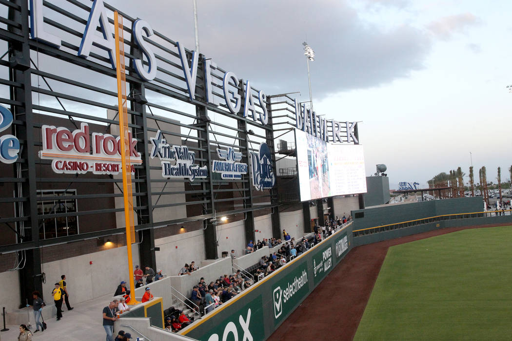 Fans watch the action from the left field wall on the first-ever opening night for the Las Vega ...