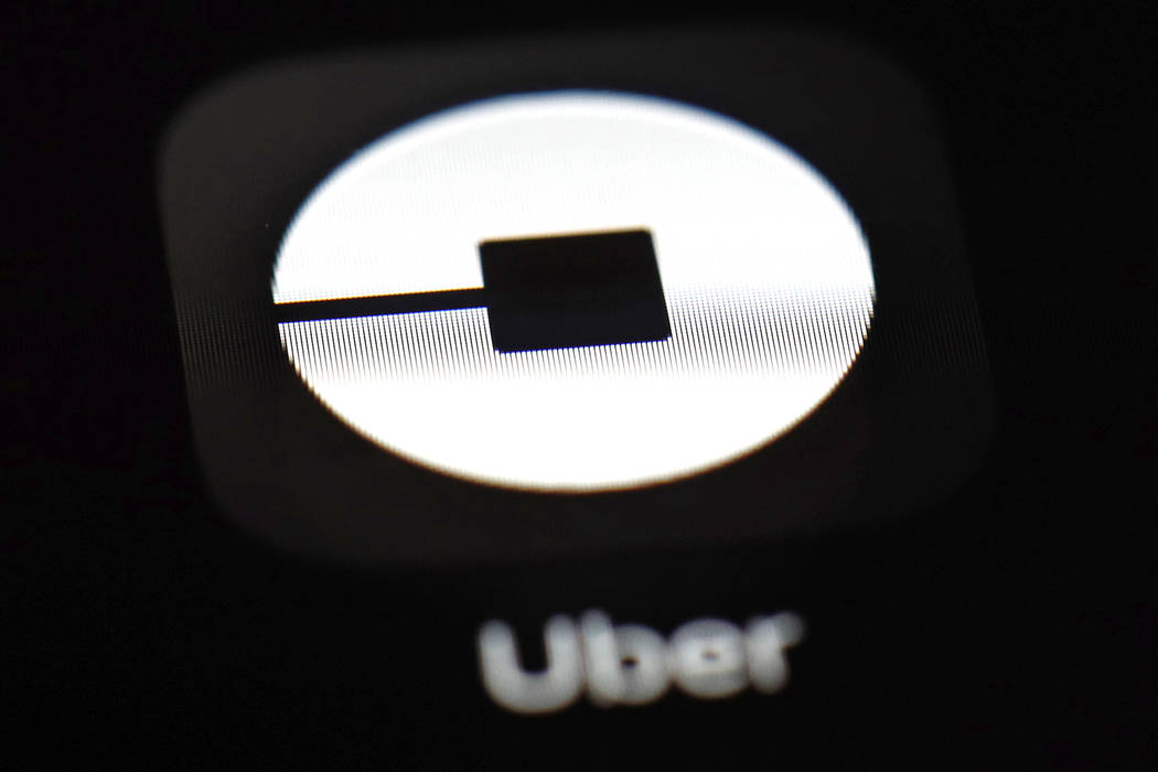 FILE - This March 20, 2018, file photo shows the Uber app on an iPad in Baltimore. Uber is abou ...