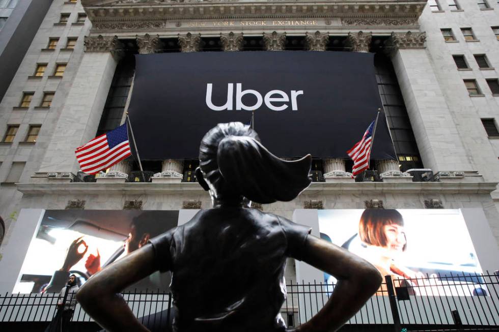 The statue of Fearless Girl stands in front of the New York Stock Exchange before Uber, the wor ...