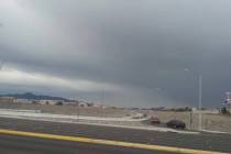 Dark clouds are seen from the 215 Beltway and Windmill Lane in the south part of the Las Vegas ...