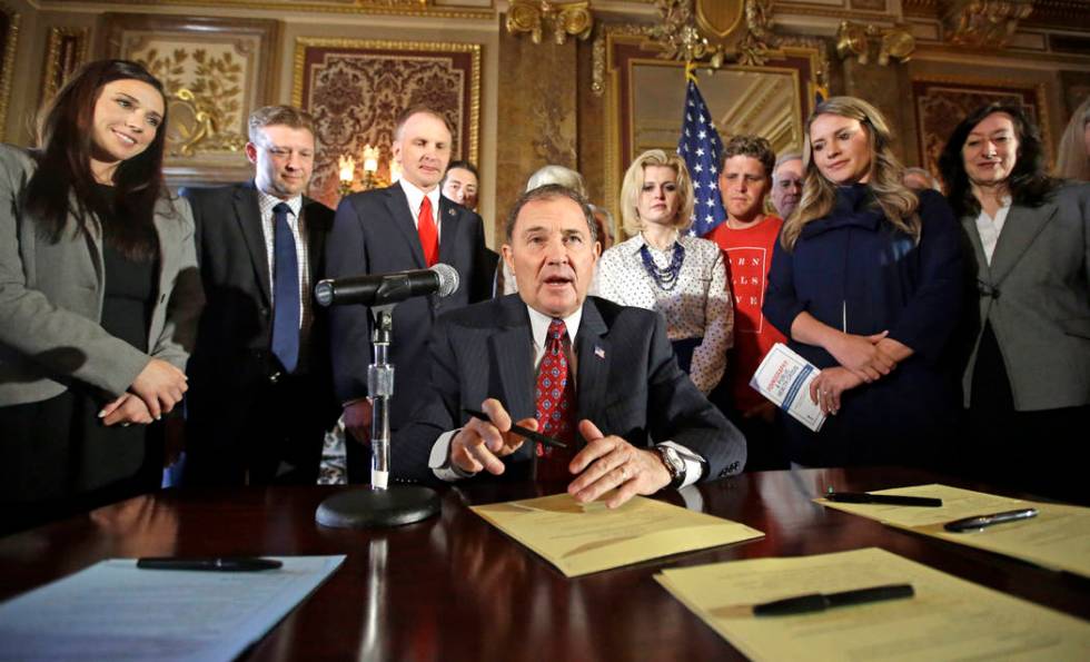 FILE - In this April 19, 2016, file photo, Utah Gov. Gary Herbert looks up during a ceremonial ...