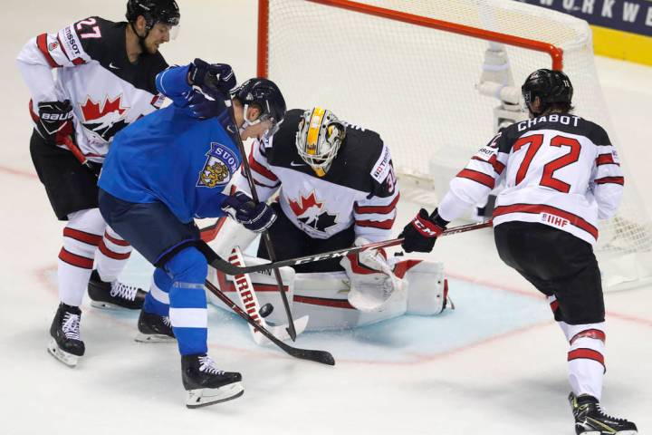 Canada's goaltender Matt Murray, 2nd right, and is teammates Thomas Chabot, right, and Shea The ...