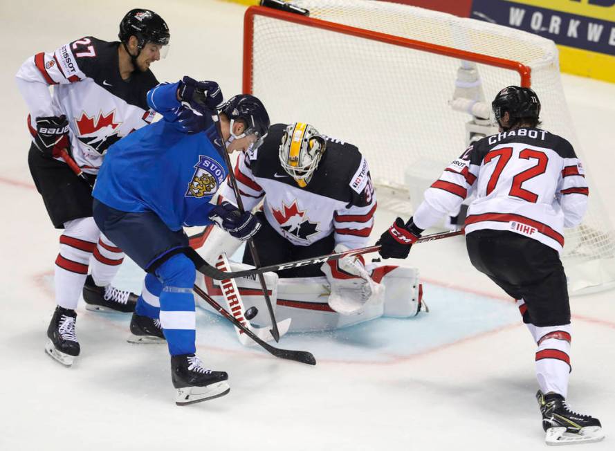 Canada's goaltender Matt Murray, 2nd right, and is teammates Thomas Chabot, right, and Shea The ...