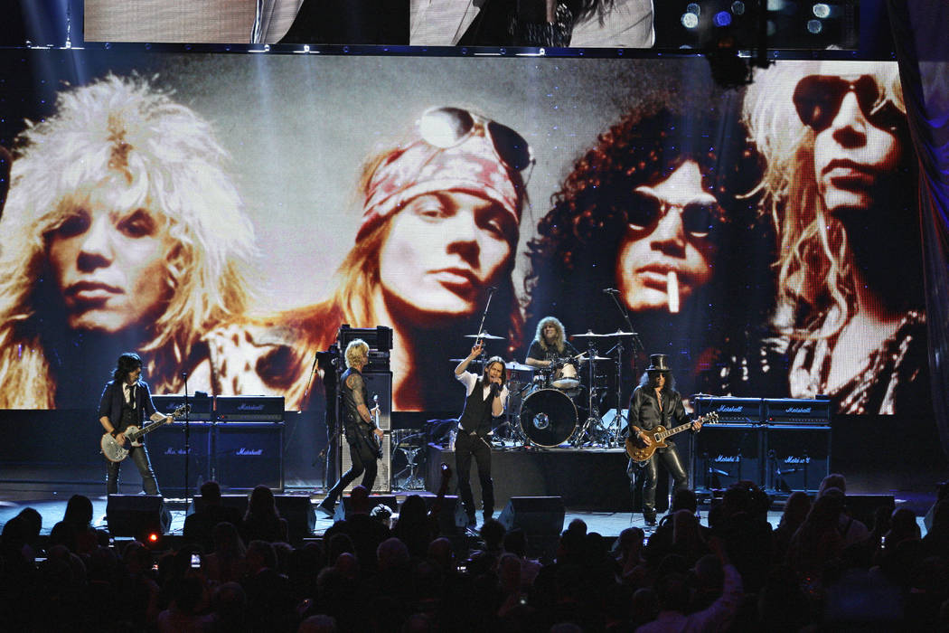In this April 15, 2012, file photo, Guns N' Roses performs with singer Myles Kennedy after thei ...