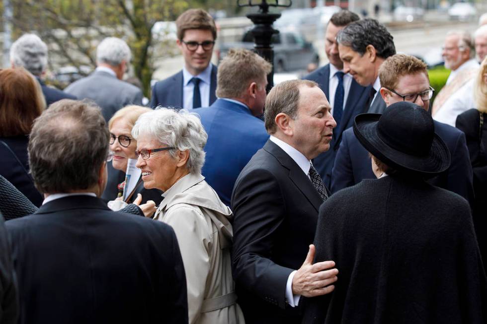 NHL commissioner Gary Bettman, center right, greets mourners following the funeral Mass for NHL ...