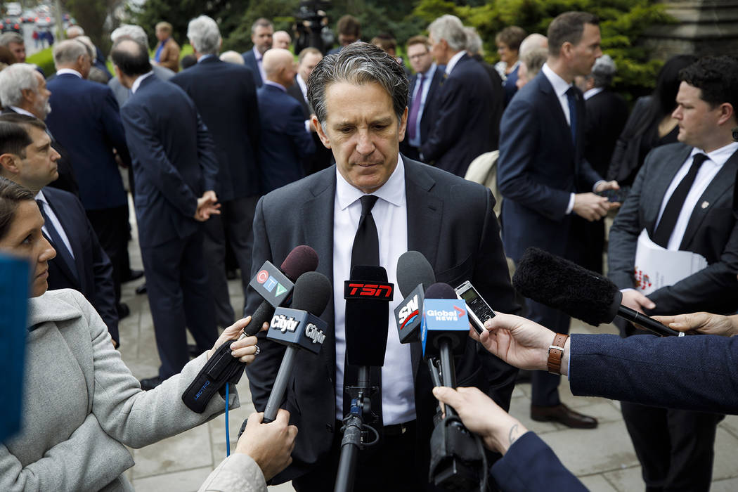 Toronto Maple Leafs president Brendan Shanahan speaks to the media following the funeral Mass f ...