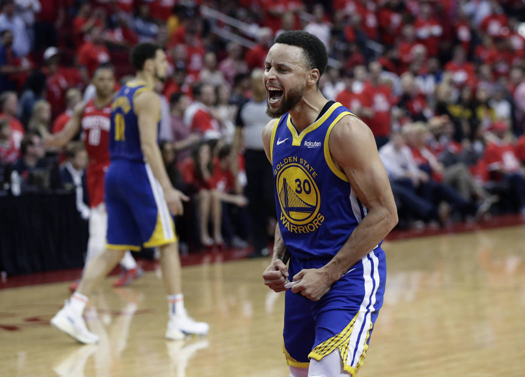 Golden State Warriors guard Stephen Curry (30) celebrates the team's win over the Houston Rocke ...