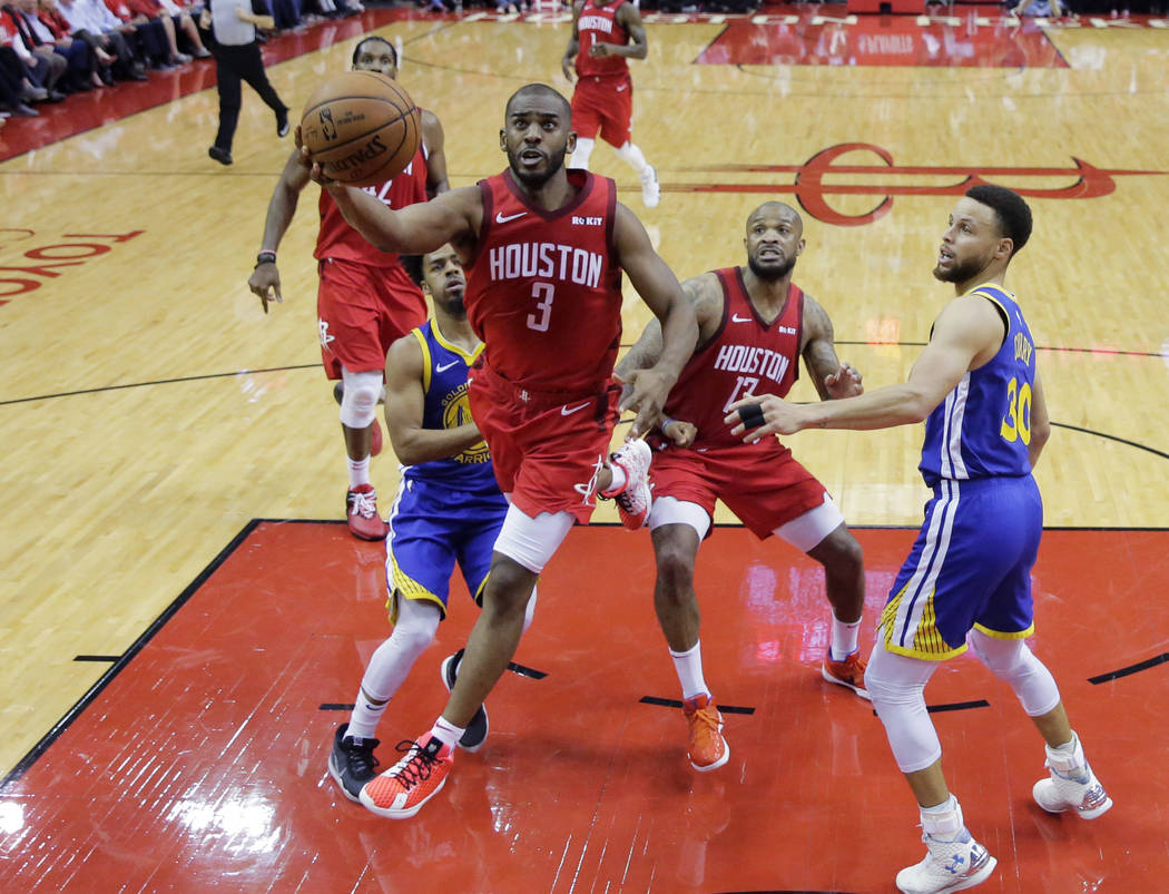 Houston Rockets guard Chris Paul (3) drives past Golden State Warriors guard Stephen Curry (30) ...