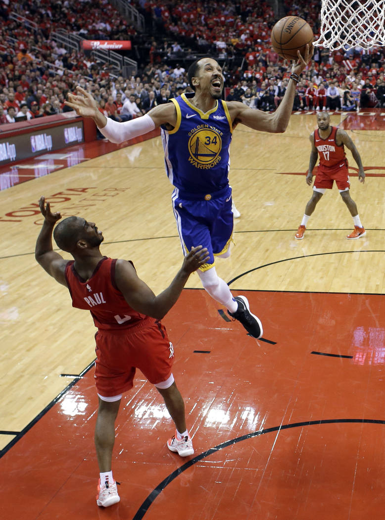 Houston Rockets' Chris Paul (3) defends as Golden State Warriors' Shaun Livingston (34) goes up ...