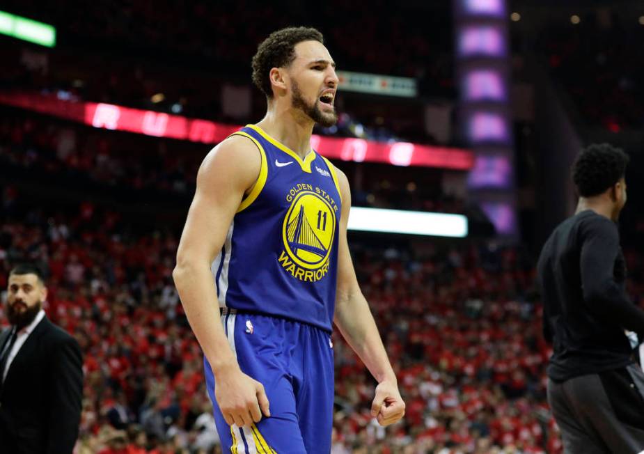 Golden State Warriors guard Klay Thompson celebrates the team's win over the Houston Rockets in ...