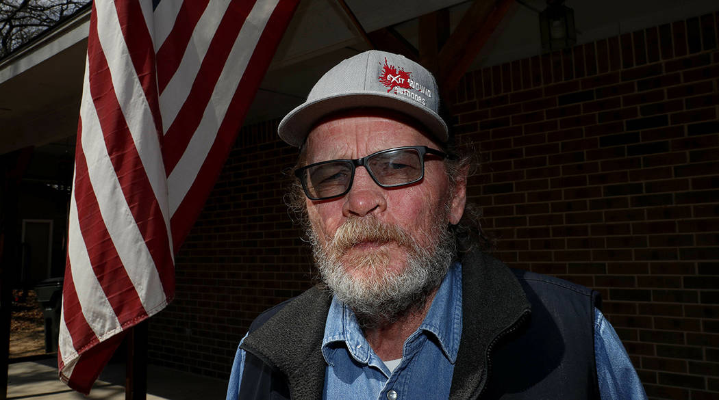 In this Friday, March 22, 2019 photo, Allan Votaw, 66, poses for a portrait outside his home in ...