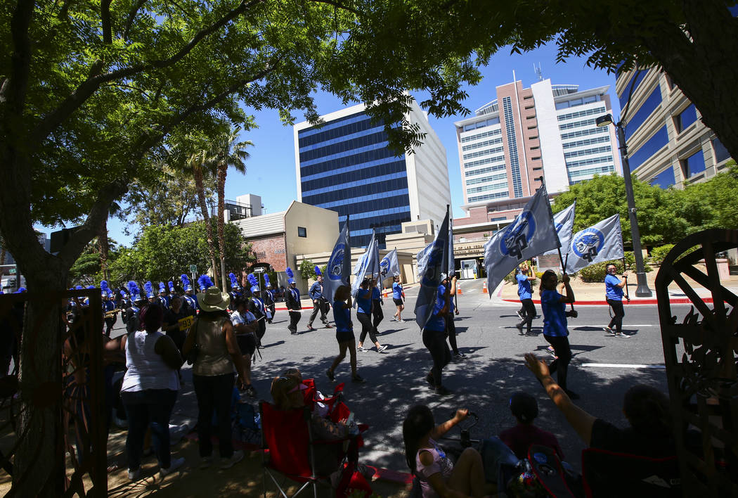 Members of the Desert Pines High School marching band participate in the Helldorado Parade alon ...