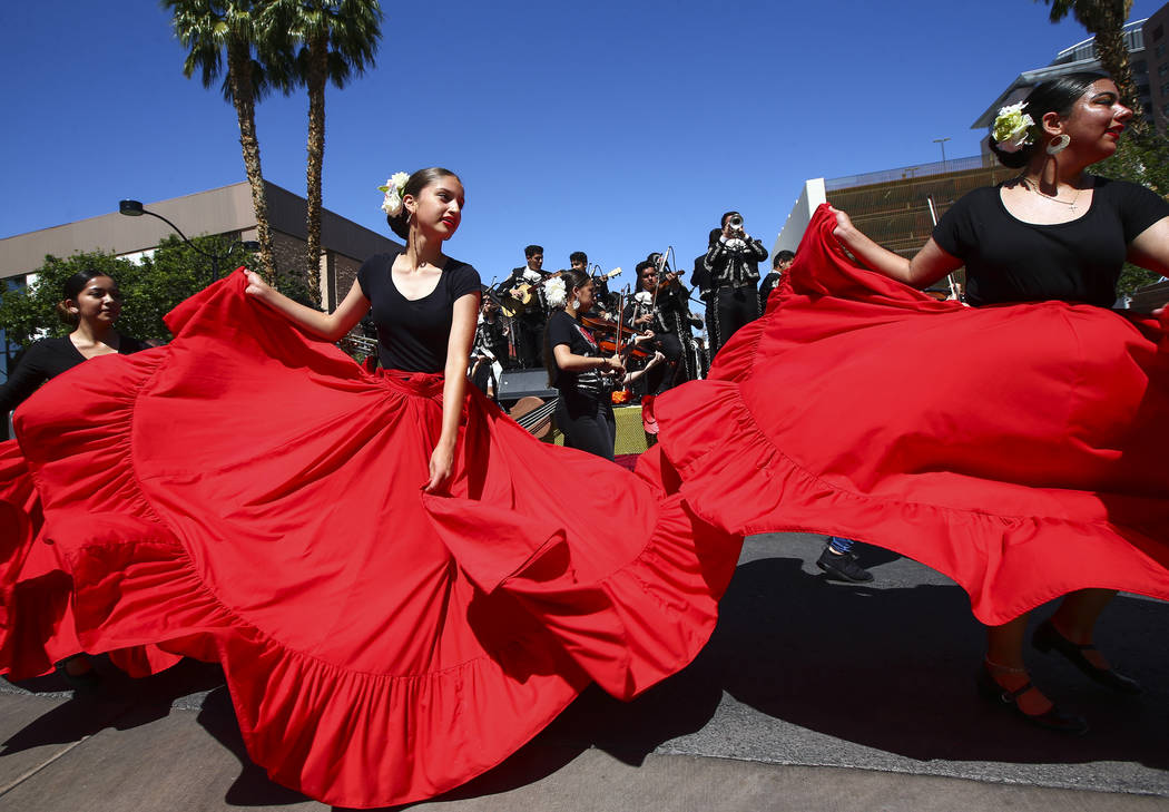 Members of Mariachi Encendido of Del Sol Academy perform during the Helldorado Parade along Fou ...