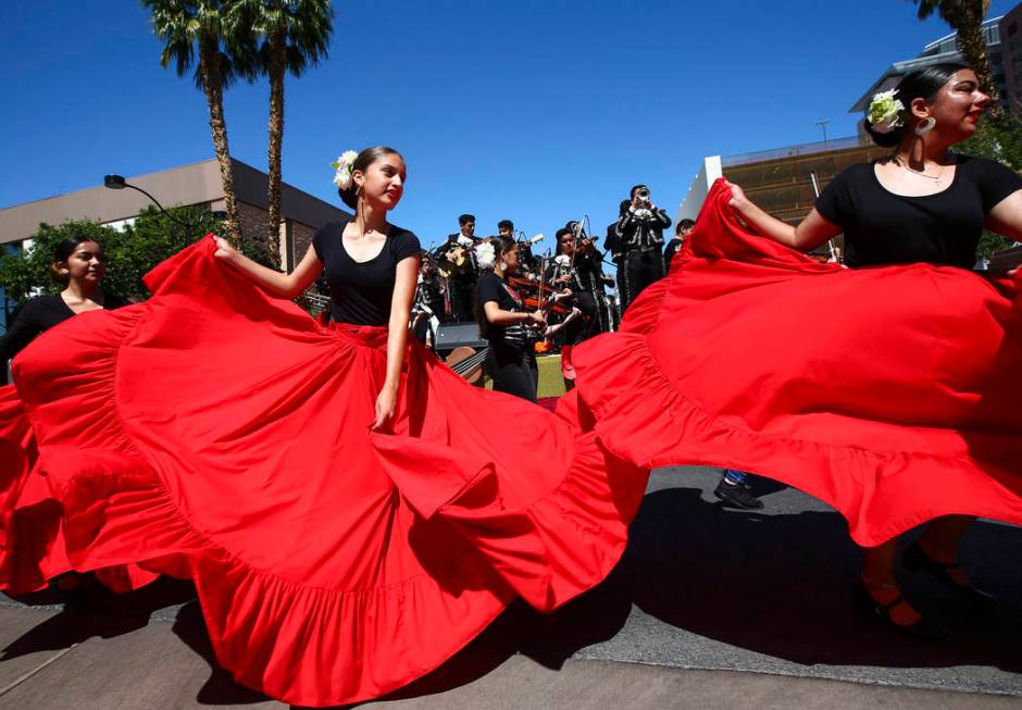 Members of Mariachi Encendido of Del Sol Academy perform during the Helldorado Parade along Fou ...