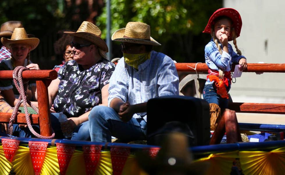 Participants on the Del Sol Academy of the Performing Arts float wear western attire during the ...