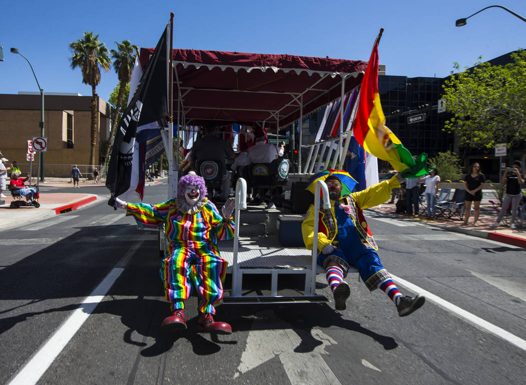 Zelzah Shrine Clowns wave to the crowd during the Helldorado Parade along Fourth Street in down ...