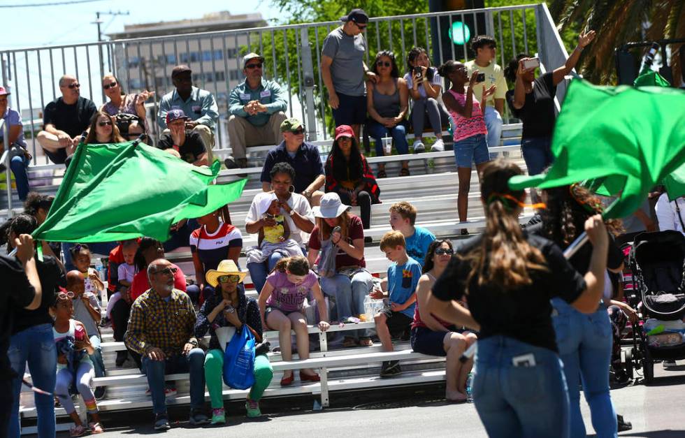 Attendees watch performers from Mojave High School during the Helldorado Parade along Fourth St ...