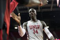 UNLV sophomore forward Cheikh Mbacke Diong (34) gets hi fives from teammates in the second half ...