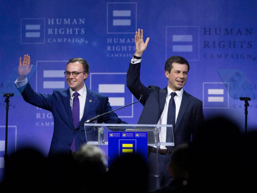 Democratic presidential candidate Pete Buttigieg, right, and husband Chasten Glezman wave to th ...