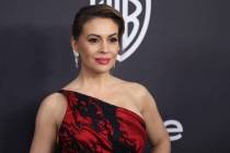 In this Jan. 6, 2019 file photo, Alyssa Milano arrives at the InStyle and Warner Bros. Golden G ...