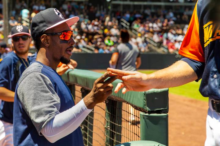 Aviators shortstop Jorge Mateo (14) encourages his teammates from the dugout as they face the T ...