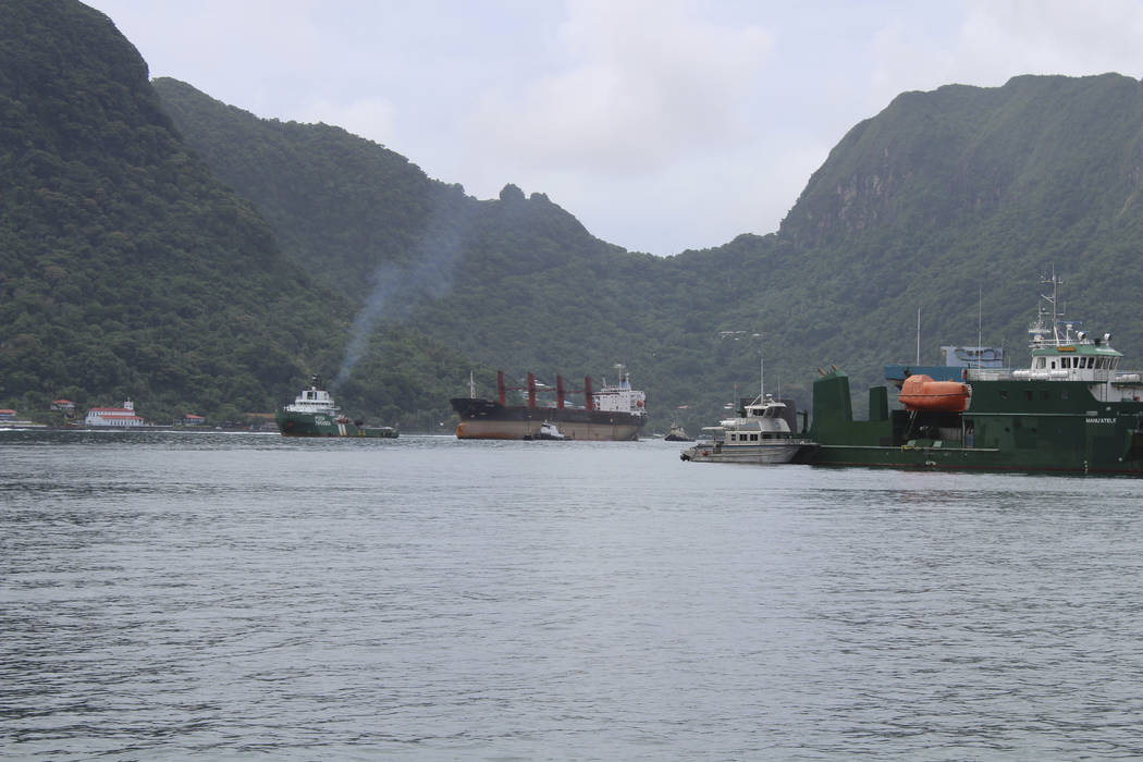 The North Korean cargo ship, Wise Honest, middle, was towed into the Pago Pago Harbor on Saturd ...