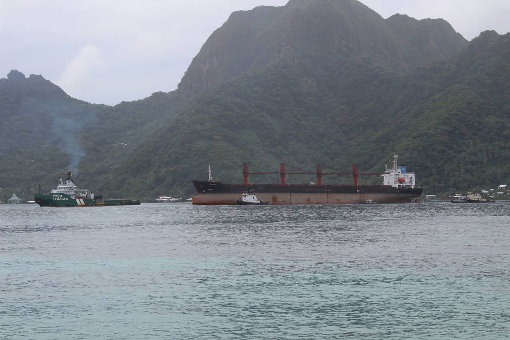 The North Korean cargo ship, Wise Honest, middle, was towed into the Port of Pago Pago in the l ...